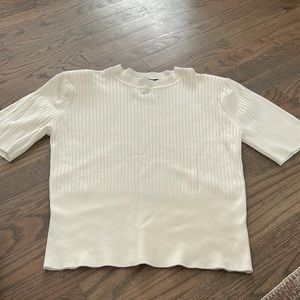 Cream colored short sleeved women’s sweater